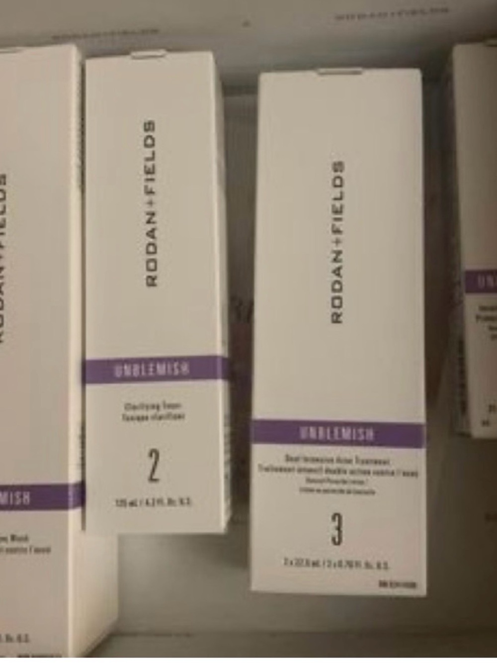 Rodan + Fields Unblemish Skincare Boxes White & Purple